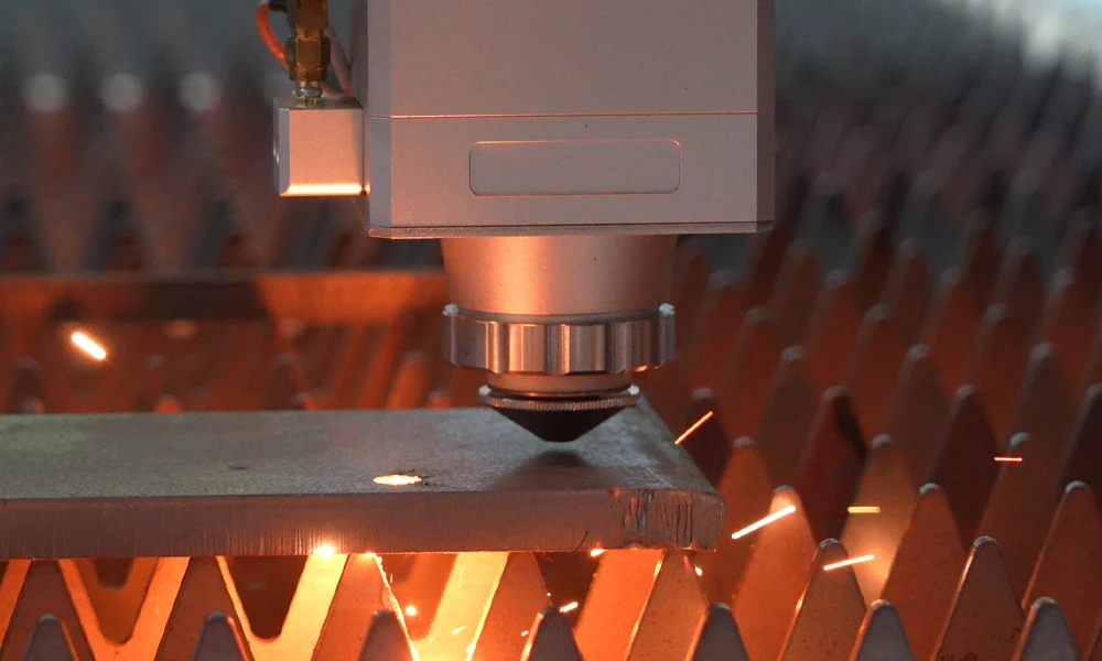 High-power fiber laser cutting system precisely trimming ultra-high-strength steel automotive body panels in an industrial manufacturing facility