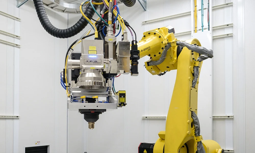 Fully automated Industry 4.0 laser processing cell with robotic arms,