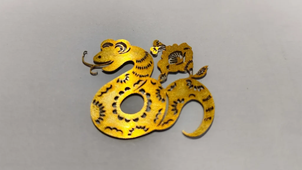 High-definition finished product showcase of precision laser-cut metal parts including stainless steel brackets, aluminum panels, and copper components with clean edges