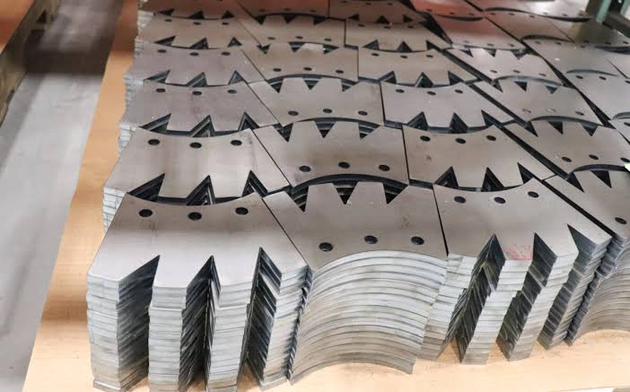 Pallets of finished laser-cut parts ready for downstream assembly
