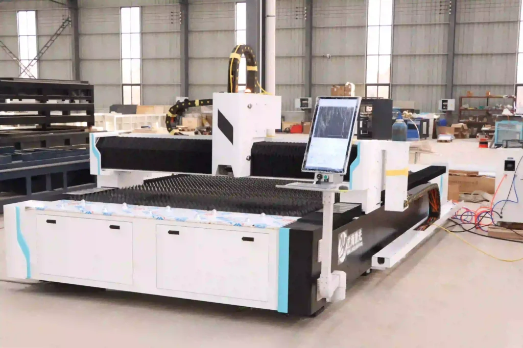 Fiber laser cutting machine cutting sheet metal in a fabrication workshop
