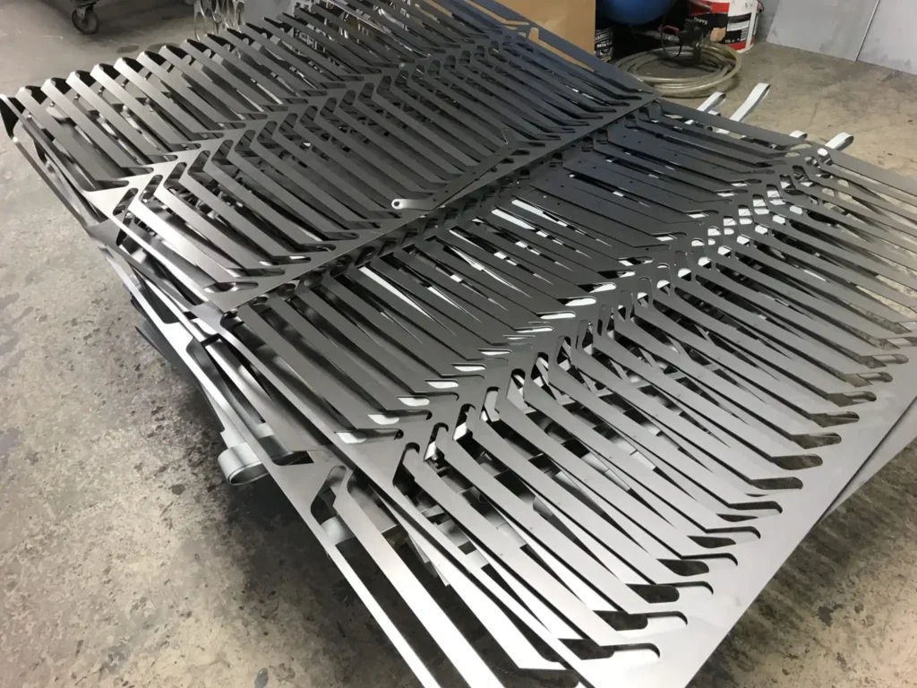 Sheet metal skeleton after fiber laser cutting showing material utilization