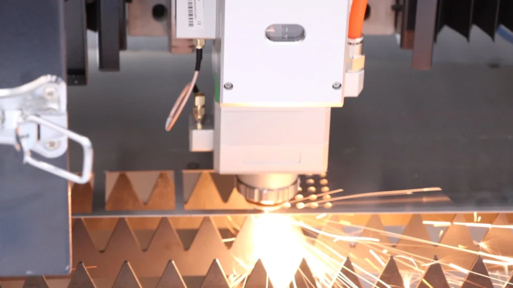 6kW fiber laser cutting machine cutting 3mm 304 stainless steel in a fabrication shop with control panel visible