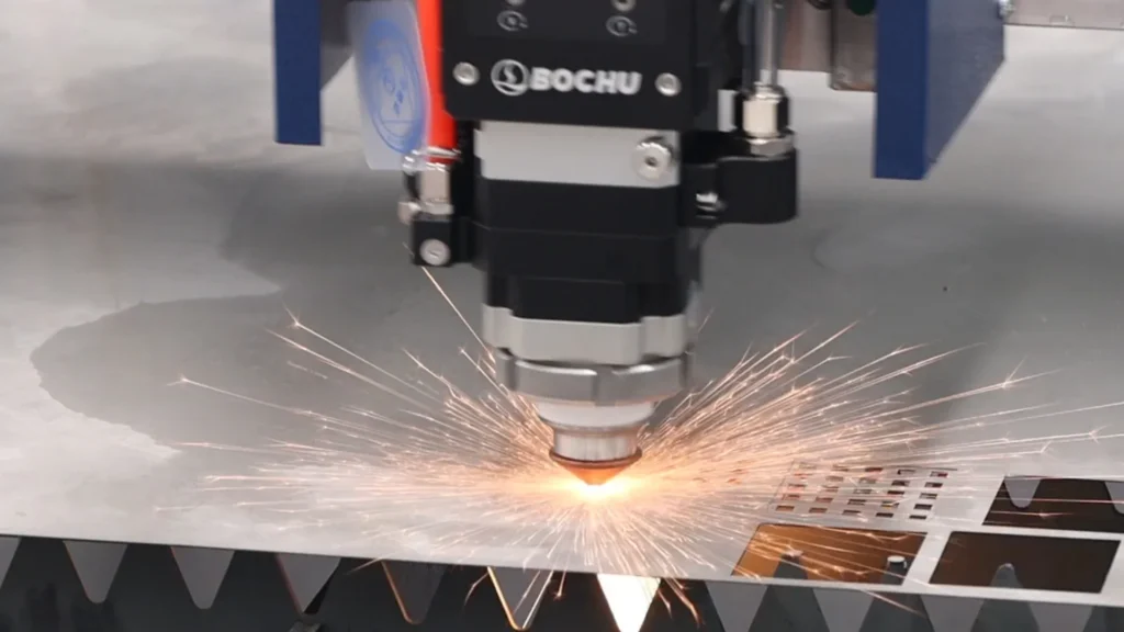 Laser cutting head processing thin stainless steel sheet for signage
