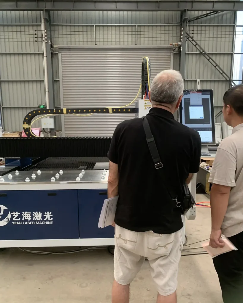 Fiber laser cutting machine in production in a fabrication workshop