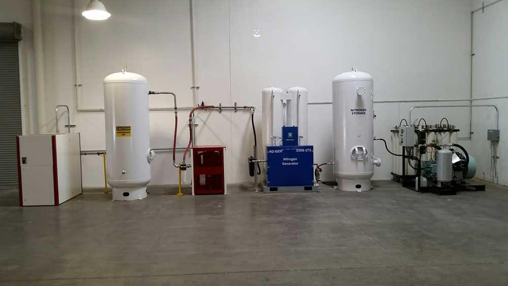 Liquid nitrogen storage tank and air compressor system outside a laser cutting workshop