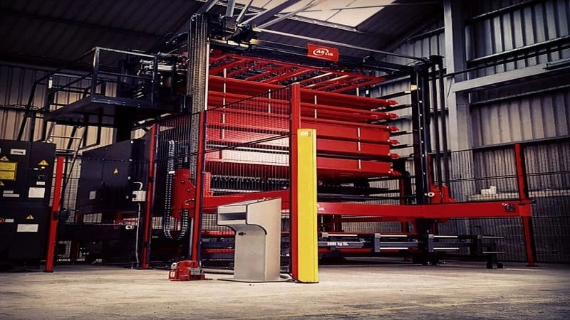 Tower stockyard laser automation system viewed from floor level showing clearance to workshop ceiling beams