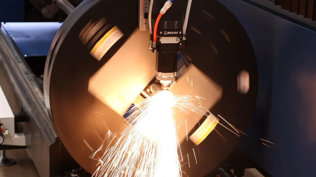 Fiber laser cutting head piercing steel tube with dynamic sparks