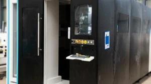 12kW fiber laser cutting machine with dual exchange tables in industrial workshop