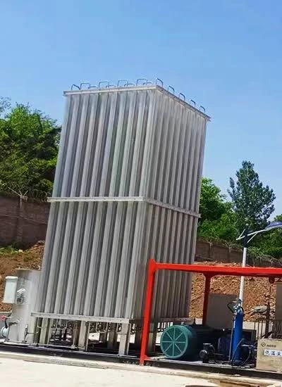 Large cryogenic bulk liquid nitrogen storage tank and ambient vaporizer installation outside a metal fabrication shop