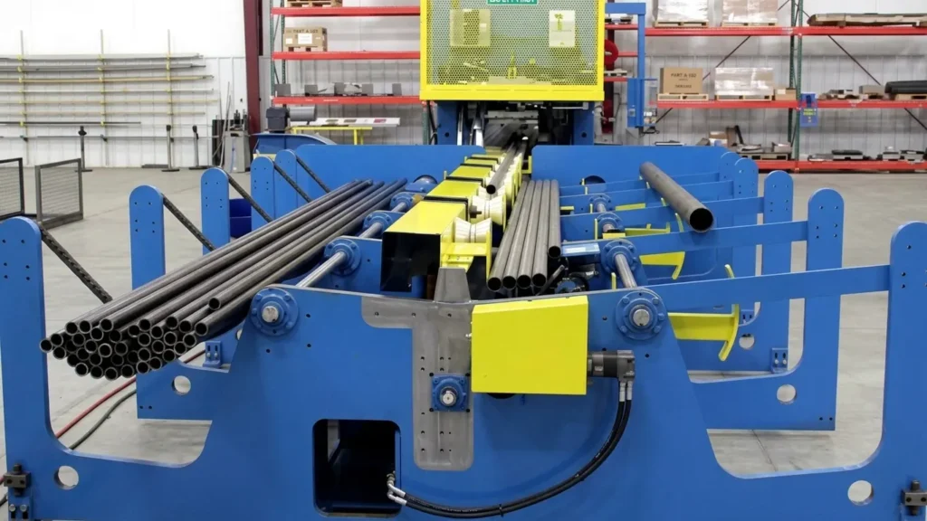 The heavy-duty chain sorting mechanism singulates individual tubes from the bundle for automated loading.