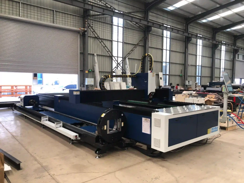 Compact floor space layout of an all-in-one sheet and tube laser cutting machine saving shop footprint