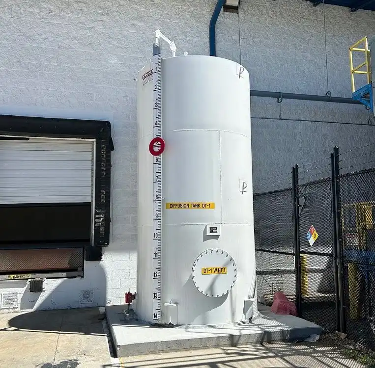 Reinforced concrete pad and safety clearance barrier for a workshop bulk liquid oxygen tank