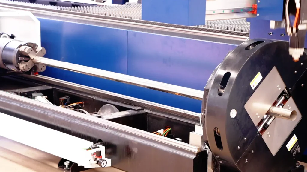 Pneumatic rear chuck feeding long steel tube through front chuck on high-speed CNC tube laser cutting machine